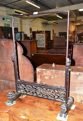 Lot 409 - A Chinese hardwood screen with carved Chinese dog supports (a.f.)