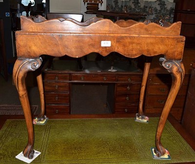 Lot 418 - A Georgian style walnut tray top table