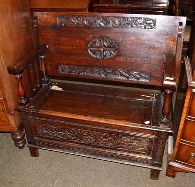 Lot 422 - An oak monk's bench