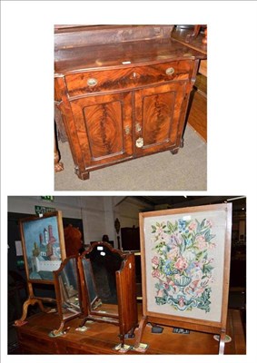 Lot 428 - A mahogany small side cabinet with two fire screens and a triptych toilet mirror