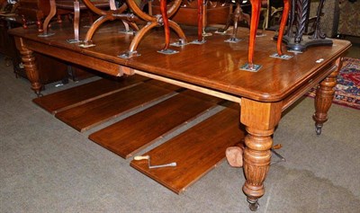 Lot 432 - An oak extending table, with six extra later leaves