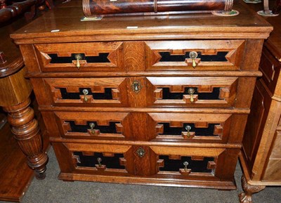 Lot 438 - 17th century oak chest of four drawers with ebonised front