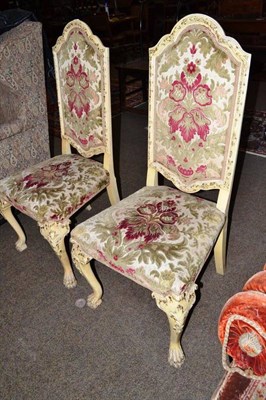 Lot 457 - Pair of cream painted parcel gilt side chairs on lion paw feet