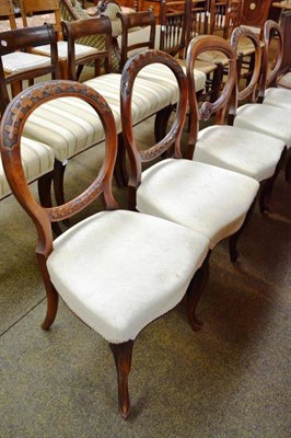 Lot 467 - A set of four Victorian walnut balloon back chairs and a similar chair