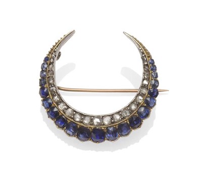 Lot 399 - A Late Victorian Sapphire and Diamond Crescent Brooch, the outer row of graduated oval cut...