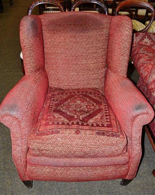 Lot 471 - Wing backed armchair