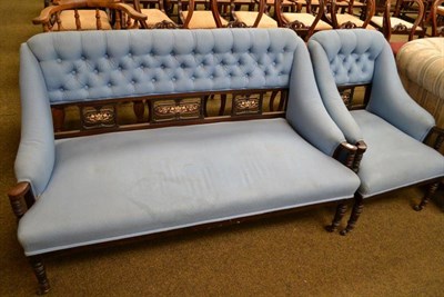 Lot 473 - An Edwardian mahogany two seater settee and armchair upholstered in blue weave