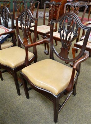 Lot 482 - A pair of Hepplewhite style mahogany elbow chairs and a matching single chair