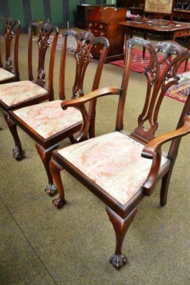 Lot 486 - A set of four Chippendale style mahogany dining chairs including an elbow chair