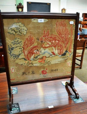 Lot 488 - A Victorian firescreen with needlework panel of two red squirrels, dated 1848