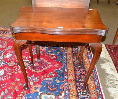 Lot 491 - A mahogany serpentine front fold-over card table