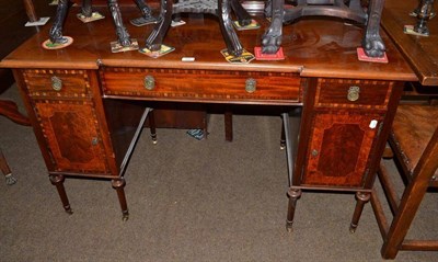 Lot 498 - An Edwardian walnut banded mahogany knee hole dressing table