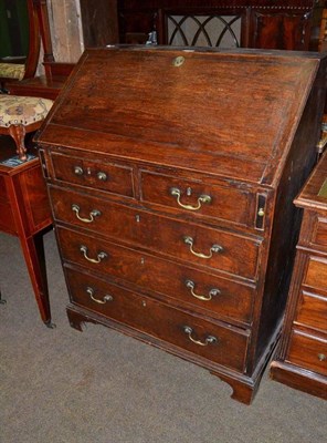 Lot 513 - George III oak bureau