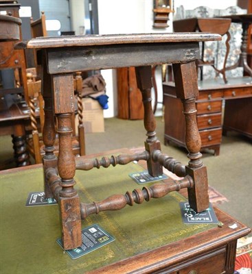 Lot 515 - An elm joint stool