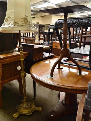 Lot 521 - A brass standard lamp and a small mahogany tripod table