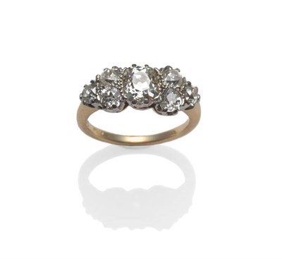 Lot 405 - A Seven Stone Diamond Ring, an old cushion cut diamond with three old cut diamonds clustered on...