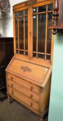 Lot 531 - A blonde oak bureau bookcase