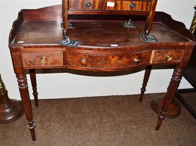 Lot 536 - A George IV mahogany break bow front washstand