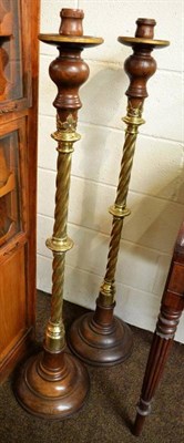 Lot 537 - A pair of oak and brass Gothic candlesticks