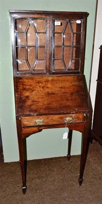 Lot 544 - A Georgian mahogany miniature bureau bookcase