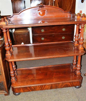 Lot 547 - A Victorian mahogany three tier buffet bearing label for the famous Irish cabinet makers,...