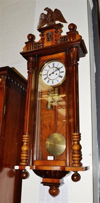 Lot 553 - A Victorian twin weight Vienna style clock with carved eagle pediment and subsidiary second dial