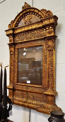 Lot 556 - Italian gilt wood and gesso wall mirror