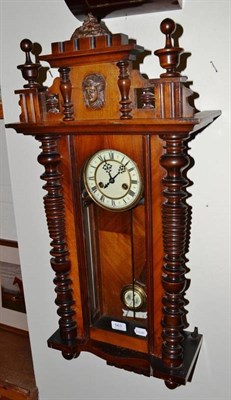 Lot 563 - A walnut Vienna style wall clock