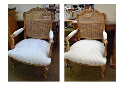 Lot 564 - A pair of Louis XV style bergère armchairs