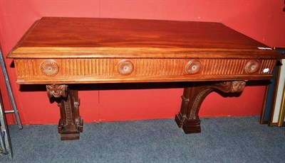 Lot 589 - A carved mahogany console table