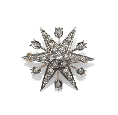 Lot 410 - An 18 Carat Gold Diamond Star Brooch, the six pointed star with a tulip terminal bar between...