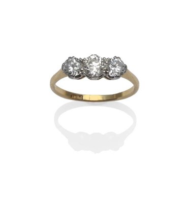 Lot 413 - A Diamond Three Stone Ring, the brilliant cut diamonds in white claw settings, to a yellow...