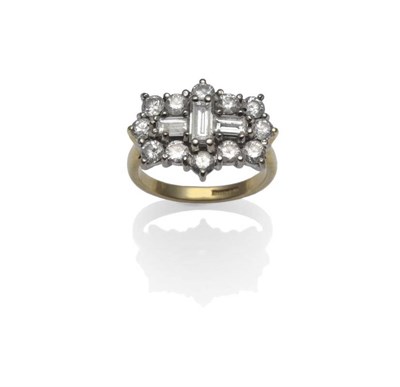 Lot 416 - An 18 Carat Gold Diamond Cluster Ring, three baguette cut diamonds, within a border of round...