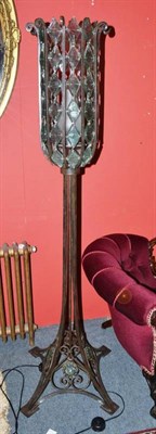 Lot 684 - A wrought iron floor standing lamp