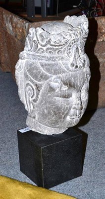 Lot 691 - A carved stone Eastern head