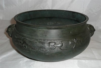 Lot 19 - A Chinese bronzed planter with elephant handles