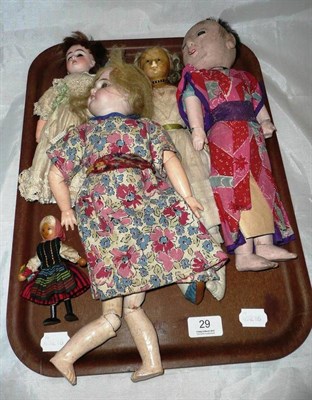 Lot 29 - Wax head doll (a.f.), two bisque head dolls, Chinese composition doll and a small wooden doll