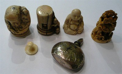 Lot 69 - A carved and articulated signed netsuke, three other carvings and a scent bottle