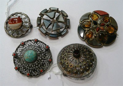 Lot 77 - Two Scottish hardstone brooches and three other brooches