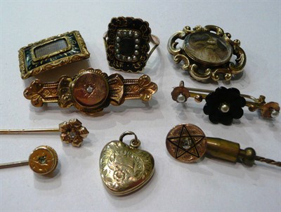 Lot 104 - A memorial ring, two similar brooches, two bar brooches, a heart locket and three stick pins (9)