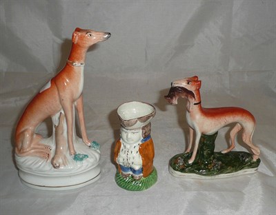 Lot 117 - Two Staffordshire dogs and a Prattware Toby jug