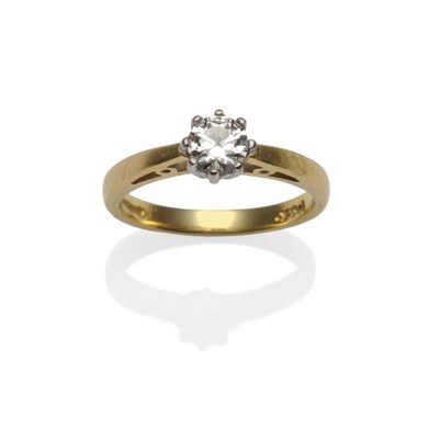 Lot 432 - An 18 Carat Gold Diamond Solitaire Ring, the round brilliant cut diamond in a white claw...