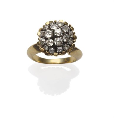 Lot 436 - An 18 Carat Gold Diamond Cluster Ring, the old cut diamonds in white claw settings, with yellow bar