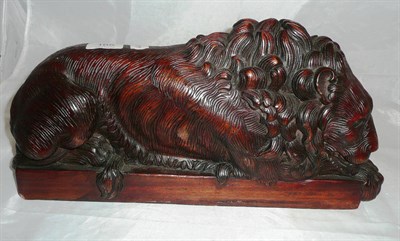 Lot 165 - Carved wood recumbent lion