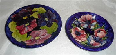 Lot 168 - Two Walter Moorcroft plates - anemone and clematis (2)