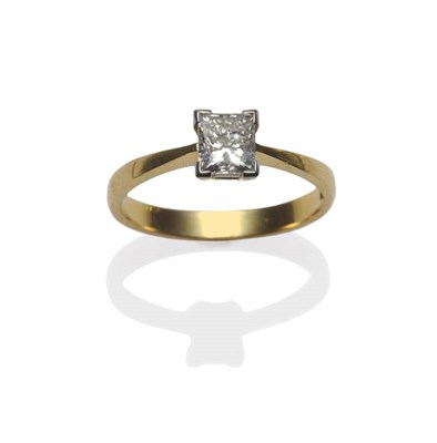 Lot 437 - An 18 Carat Gold Diamond Solitaire Ring, the princess cut diamond in a white claw setting, to a...