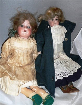 Lot 200 - Armand Marseille 390 bisque socket head doll and a bisque shoulder head doll with blond wig,...