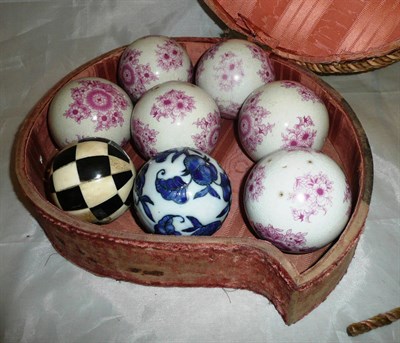 Lot 203 - Set of six carpet bowls and two others in needlework box