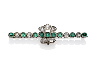 Lot 441 - An Emerald and Diamond Bar Brooch, circa 1900, the bar set with alternating step cut emeralds...