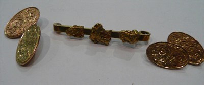 Lot 215 - A pair of 9ct gold cufflinks and a gold nugget bar brooch